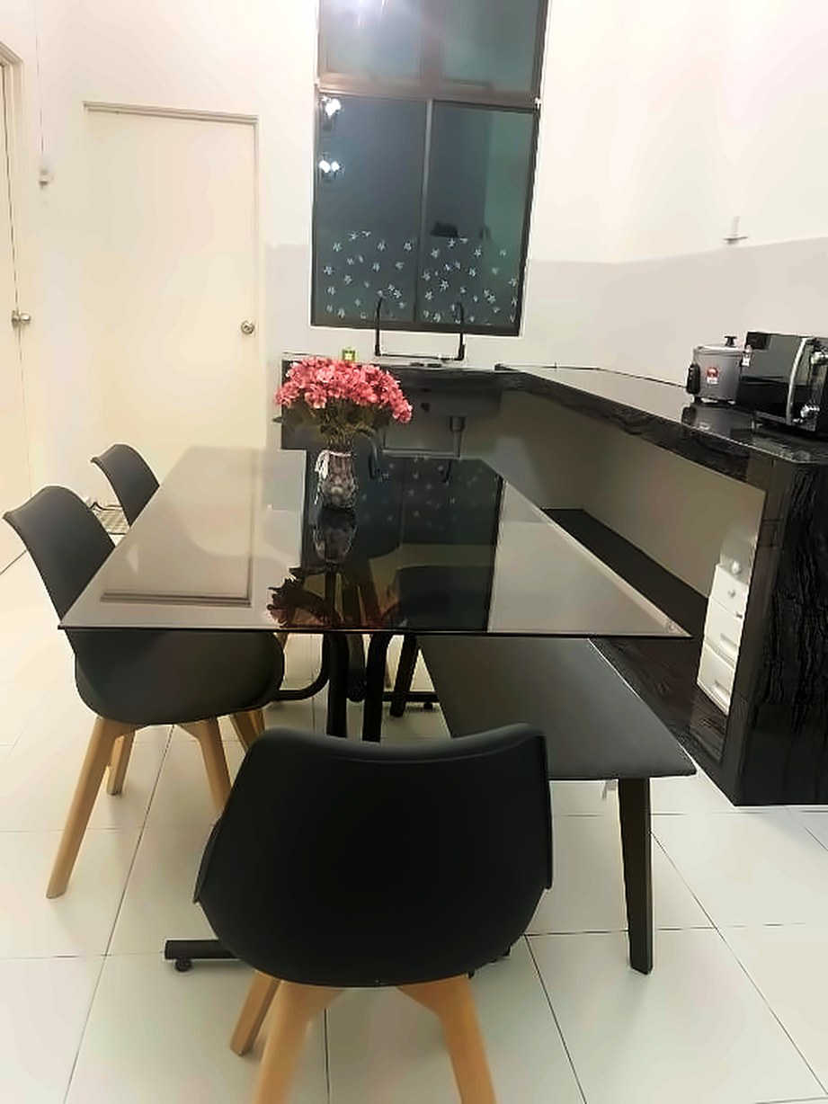 Glass dining table with chairs and a bench