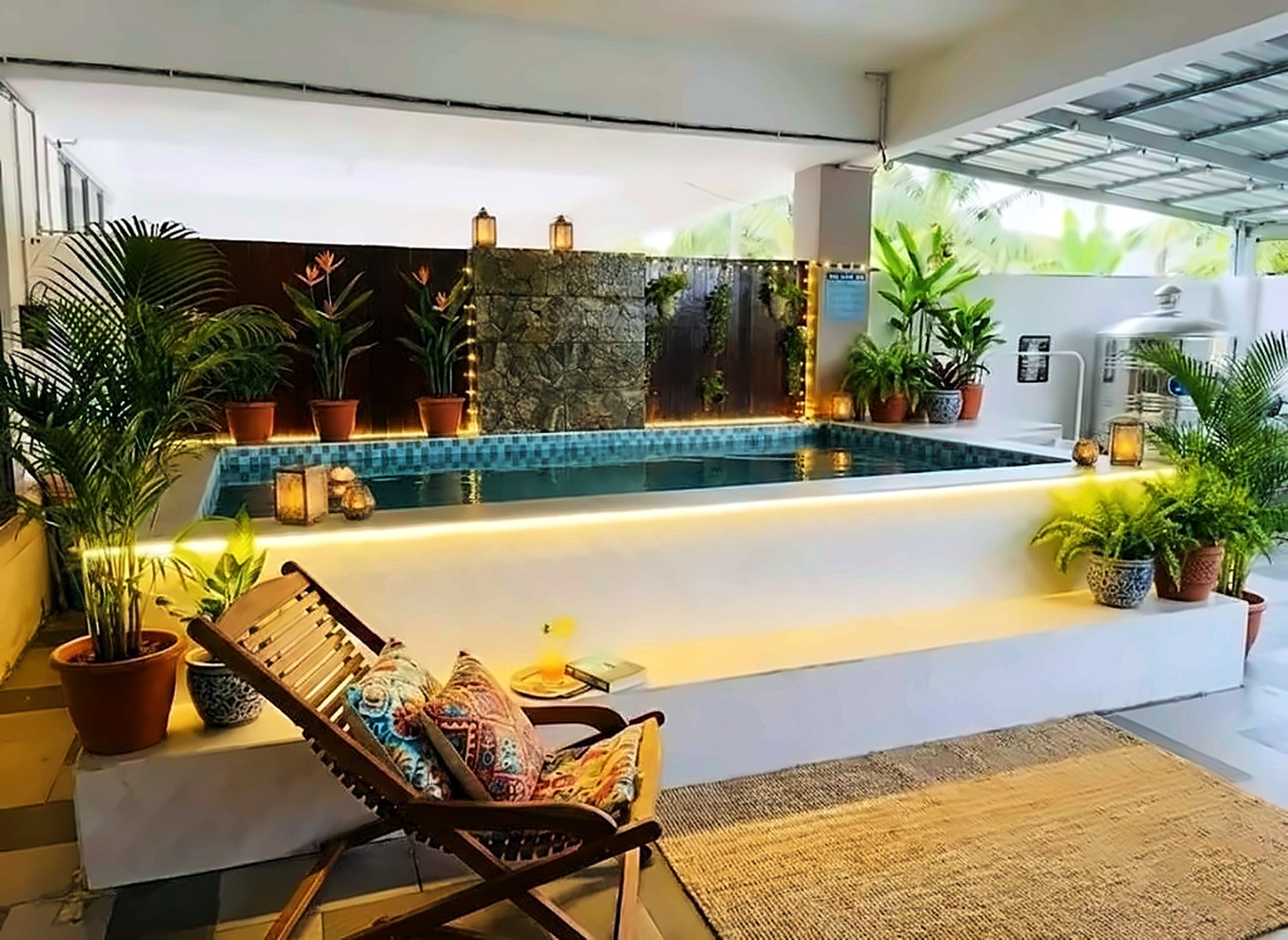 Sulong Inn homestay Kuantan private pool at dusk, glowing with lanterns and surrounded by tropical plants